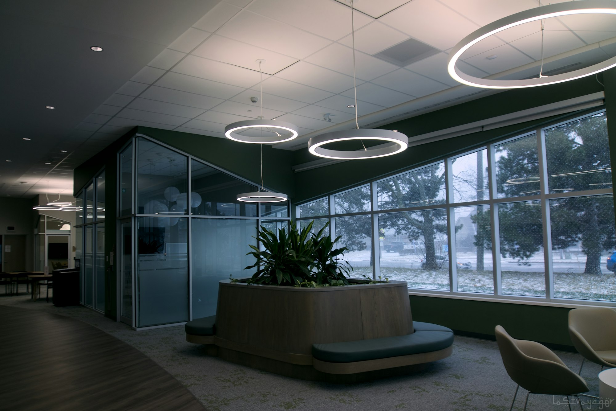 Modern institutional office lobby with large windows